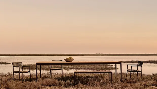 Tribù outdoor dining collection at dusk
